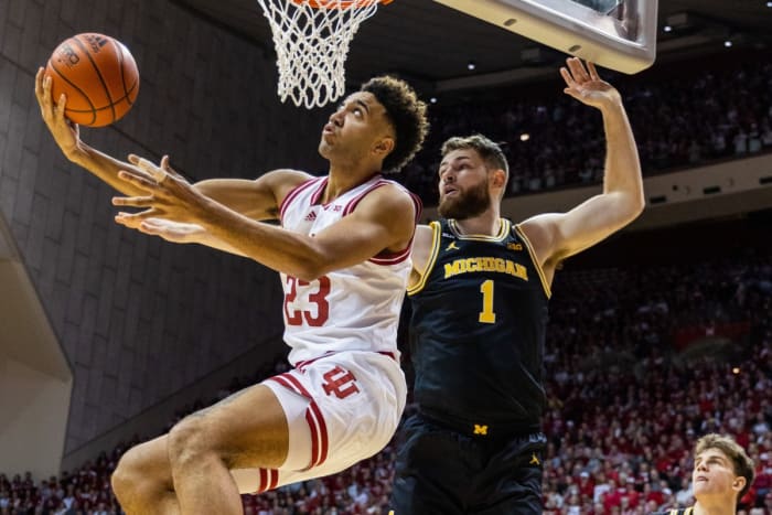 Indiana Hoosiers forward Trayce Jackson-Davis (23) shoots the ball while Michigan Wolverines center Hunter Dickinson (1) defends in the first half at Simon Skjodt Assembly Hall.